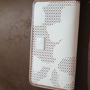 Cream color trimmed in brown fossil wallet